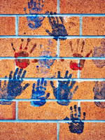 Handprints on Brick Wall