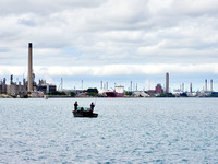 Fishing in Front of the Oil Refineries